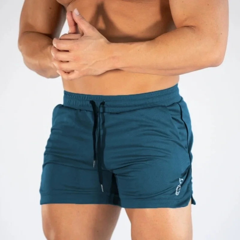 2025 NUEVOS pantalones cortos de entrenamiento de gimnasia para hombre, ropa deportiva informal para hombre, pantalones de playa con rejilla para correr, pantalones cortos transpirables de secado rápido para hombre