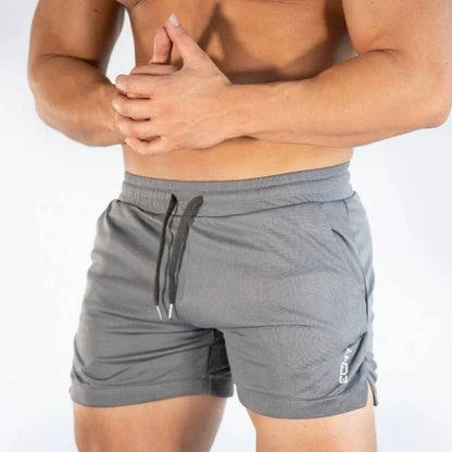 2025 NUEVOS pantalones cortos de entrenamiento de gimnasia para hombre, ropa deportiva informal para hombre, pantalones de playa con rejilla para correr, pantalones cortos transpirables de secado rápido para hombre