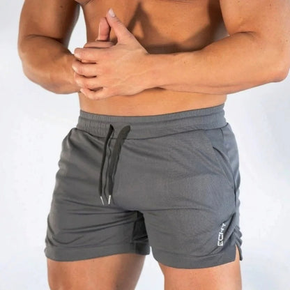 2025 NUEVOS pantalones cortos de entrenamiento de gimnasia para hombre, ropa deportiva informal para hombre, pantalones de playa con rejilla para correr, pantalones cortos transpirables de secado rápido para hombre